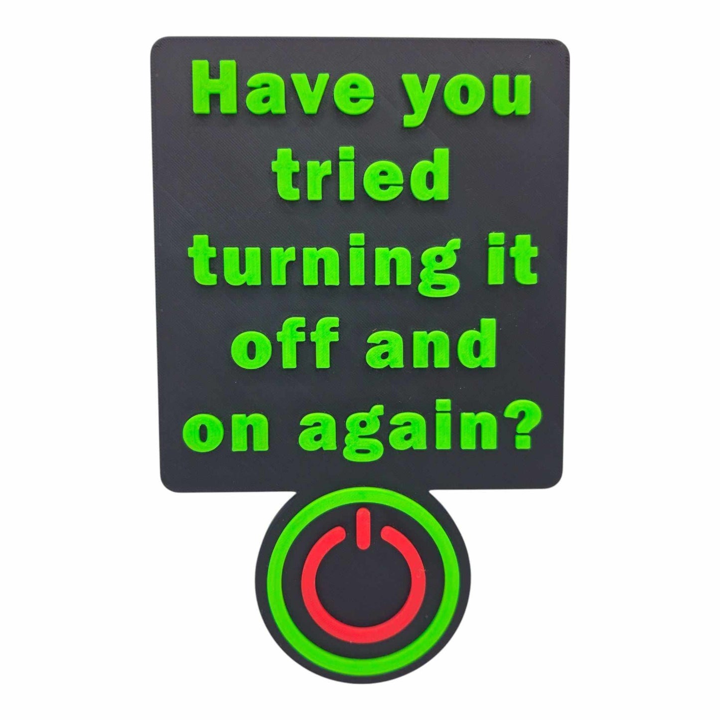 3D printed Have You Tried Turning It Off and On Again sign with raised green text and red power button on black background for tech decor