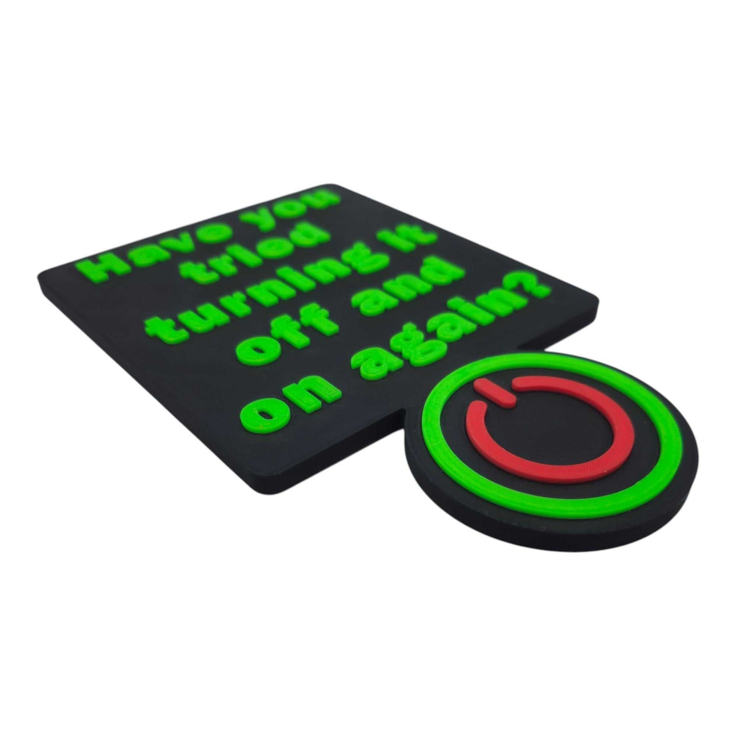 3D printable office sign with raised green text "Have you tried turning it off and on again?" and a red and green power button symbol on black background