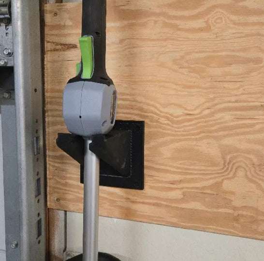 Durable wall-mounted EGO string trimmer holder for space-saving storage.