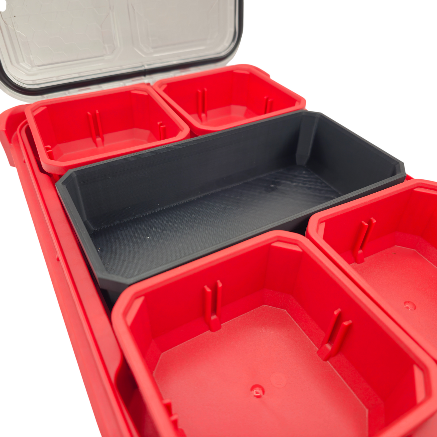 Black Milwaukee Pack-out Slim long bin without divider installed in red Packout organizer for longer tool storage