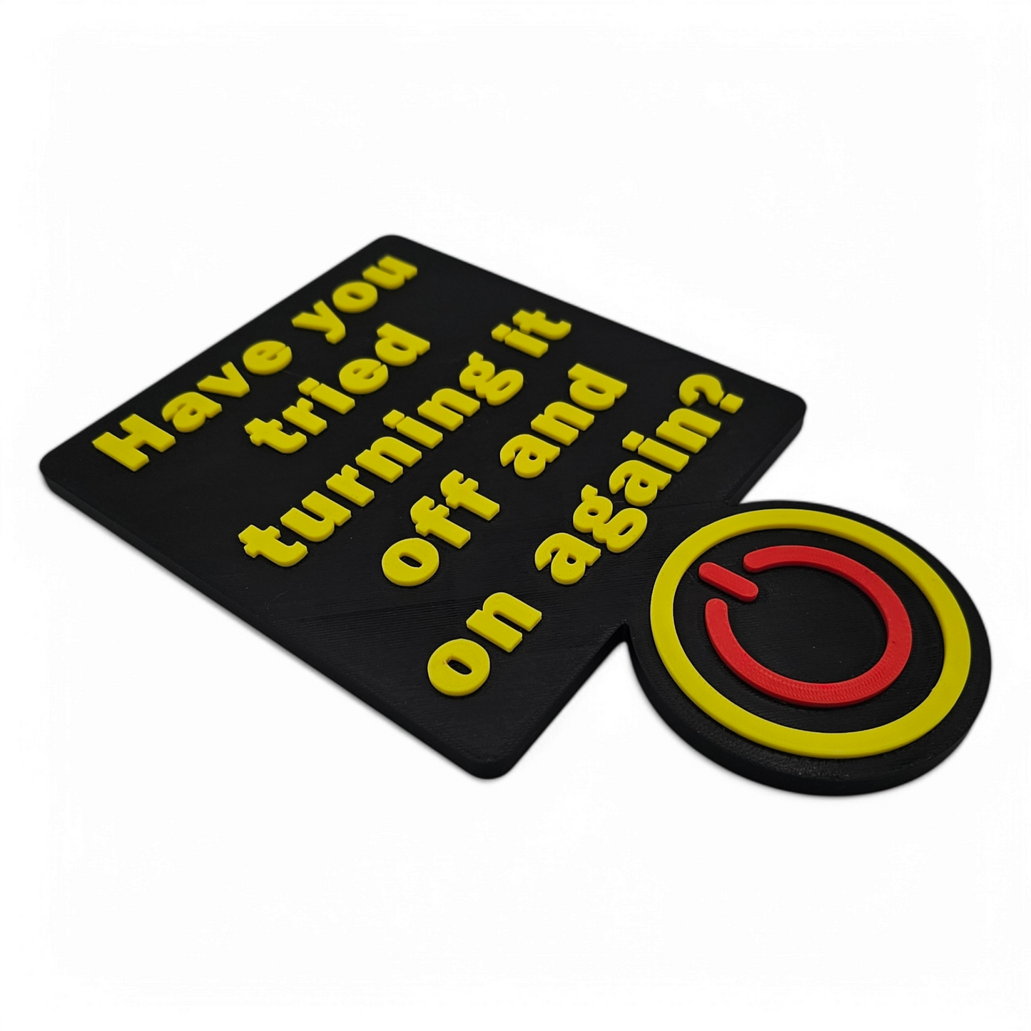 3D printed "Have You Tried Turning It Off and On Again?" sign with yellow text and red power button on black background