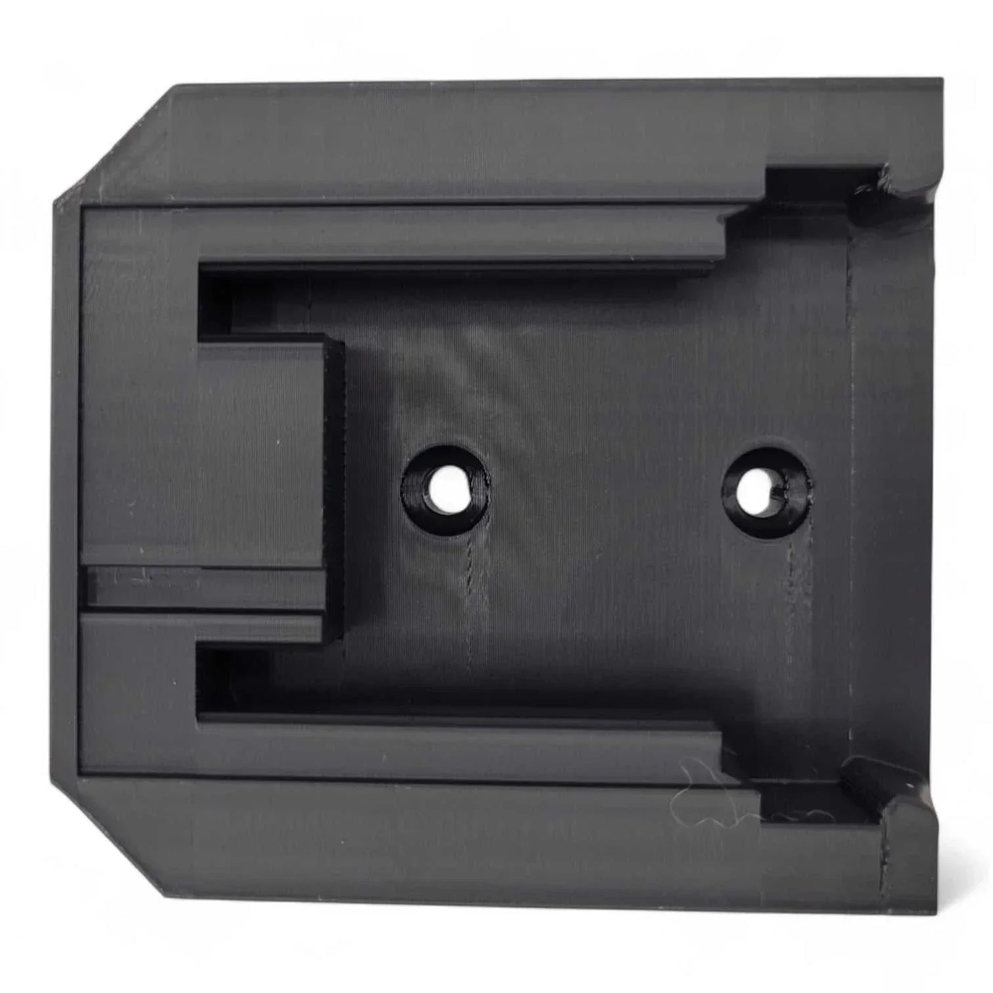 Milwaukee M18 Battery Wall Mount in durable PETG, black, heavy-duty design with two screw holes for secure mounting.