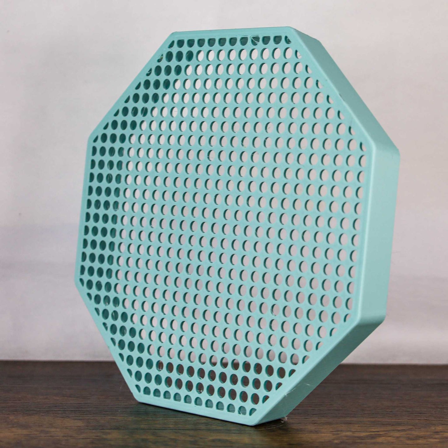 8" octagon enamel pin board display in teal, wall mountable or self-standing with perforated design for organizing pins