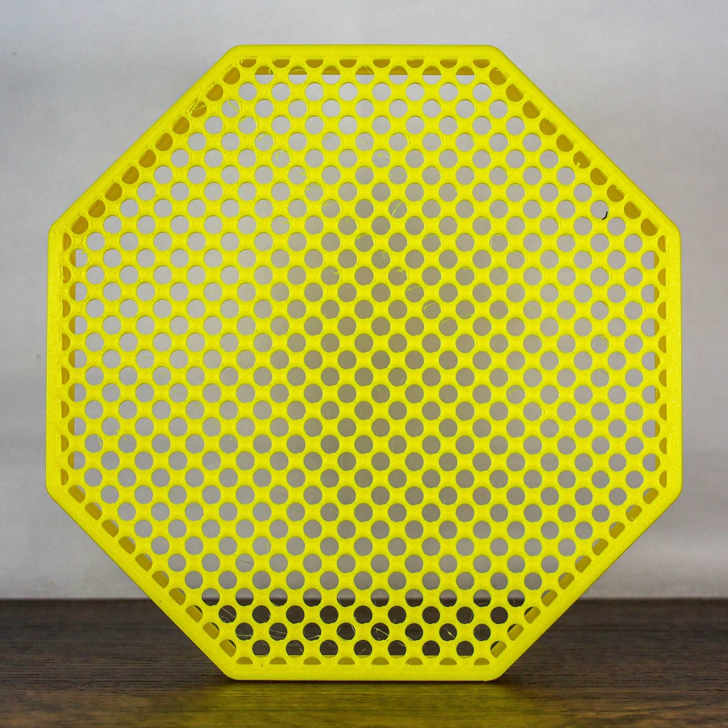 8" octagon enamel pin board display in yellow with perforated design for wall mounting or self-standing showcase