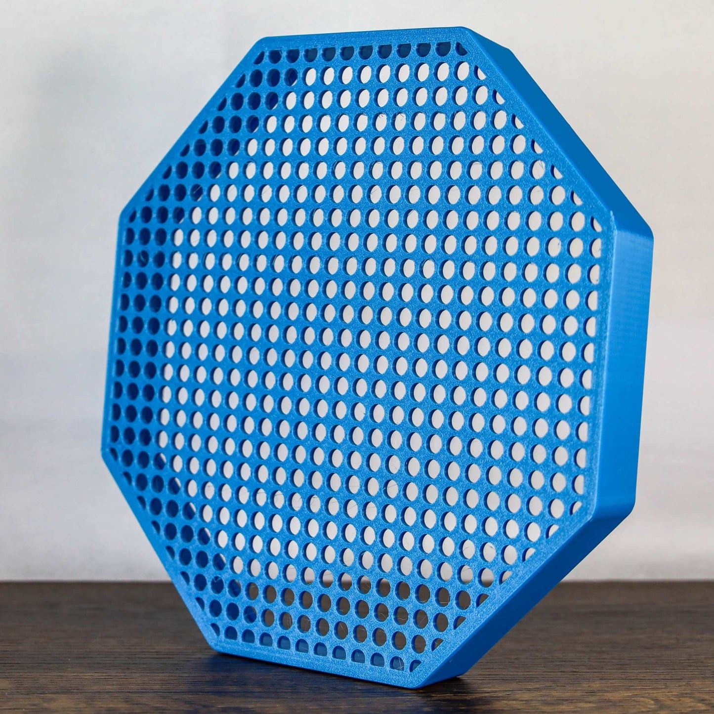 8" blue octagon enamel pin board display with perforated design for wall mount or self-standing use