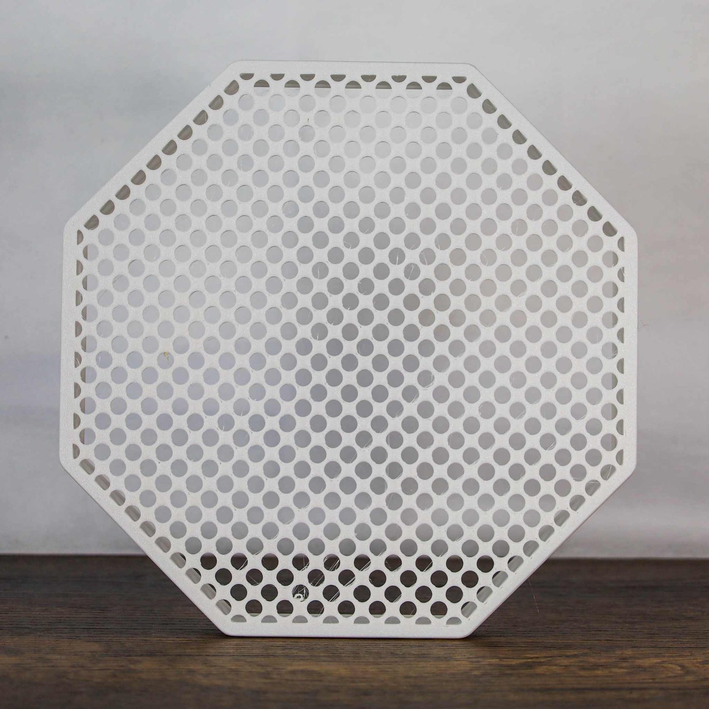 8" octagon enamel pin board display with perforated design for wall mounting or self-standing use