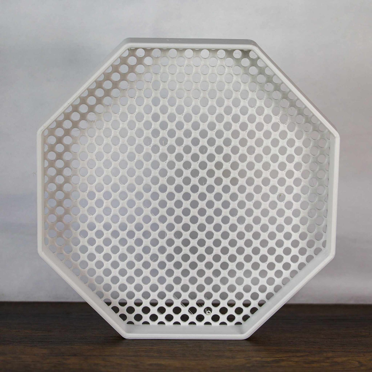 8-inch octagon enamel pin board display with perforated surface for wall mounting or self-standing use