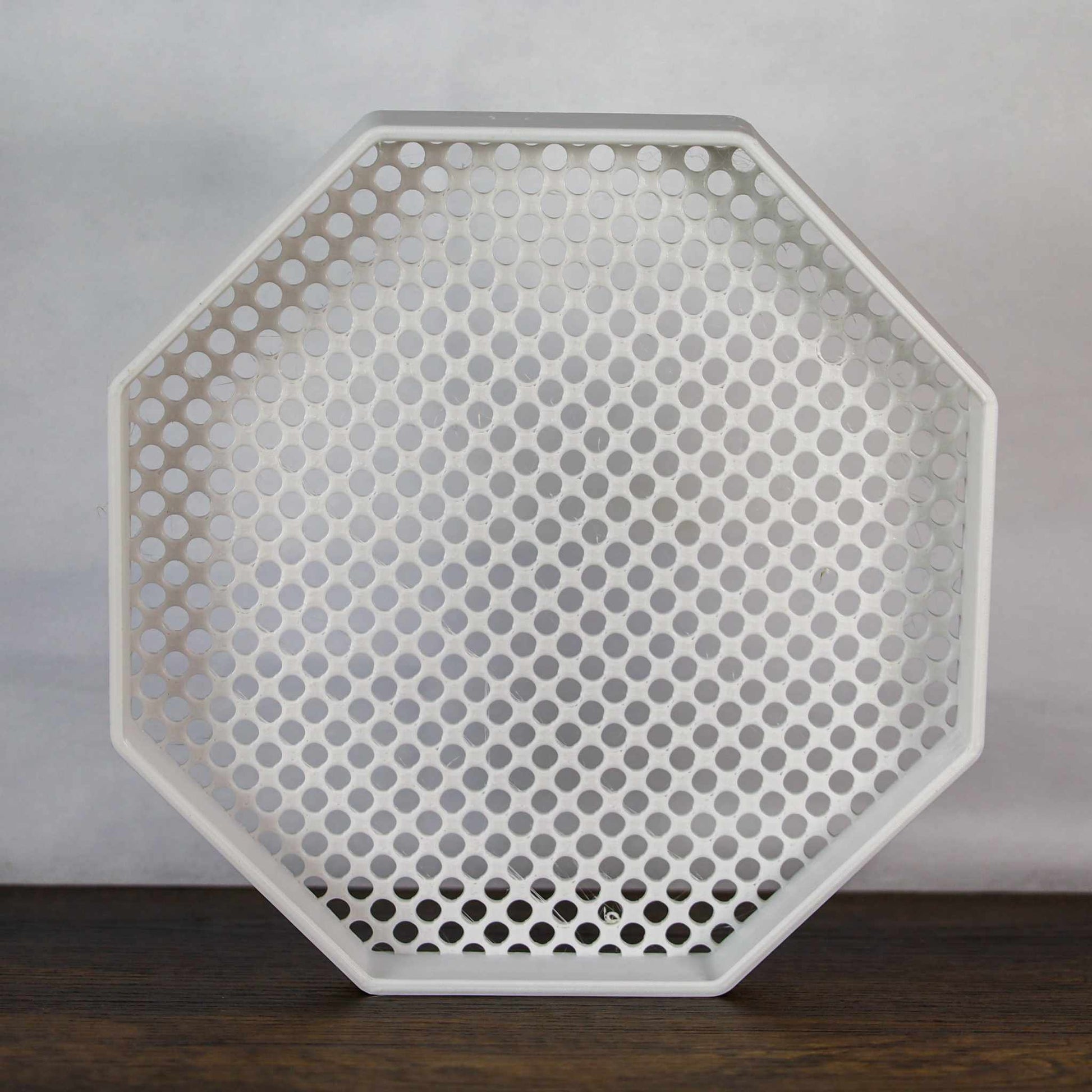 8-inch octagon enamel pin board display with perforated surface for wall mounting or self-standing use