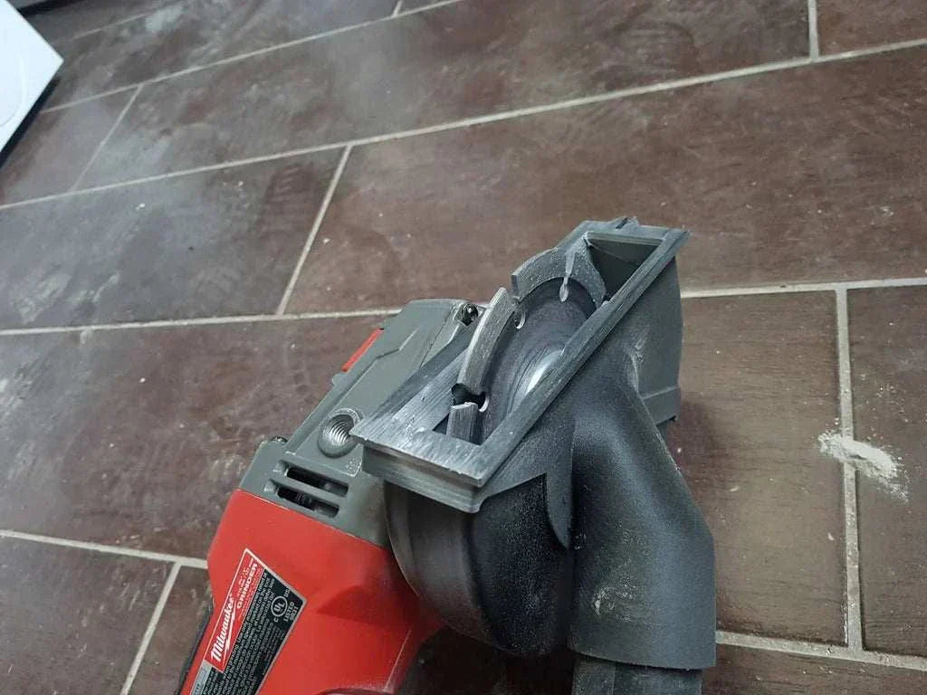 Milwaukee M18 Grinder with Dust Collection Adapter for Type 1 Guard, enhancing dust control on masonry and tile cutting jobs.