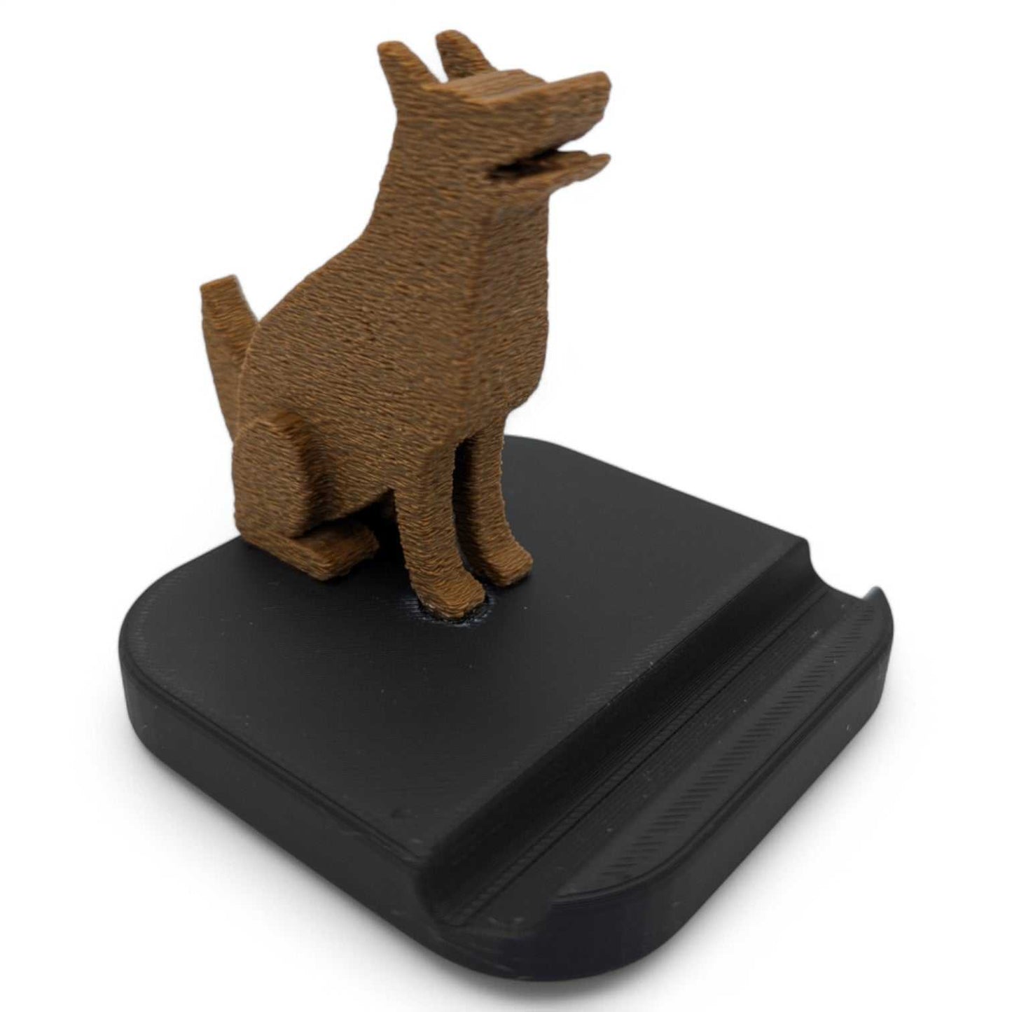 German Shepherd dog figurine phone stand with black base for holding smartphones vertically or horizontally.